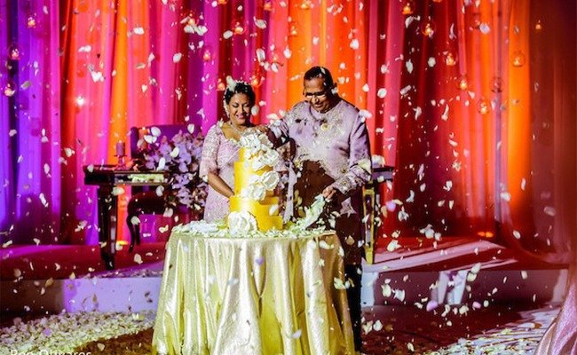Bride in beautiful dress sitting resting on sofa indoors